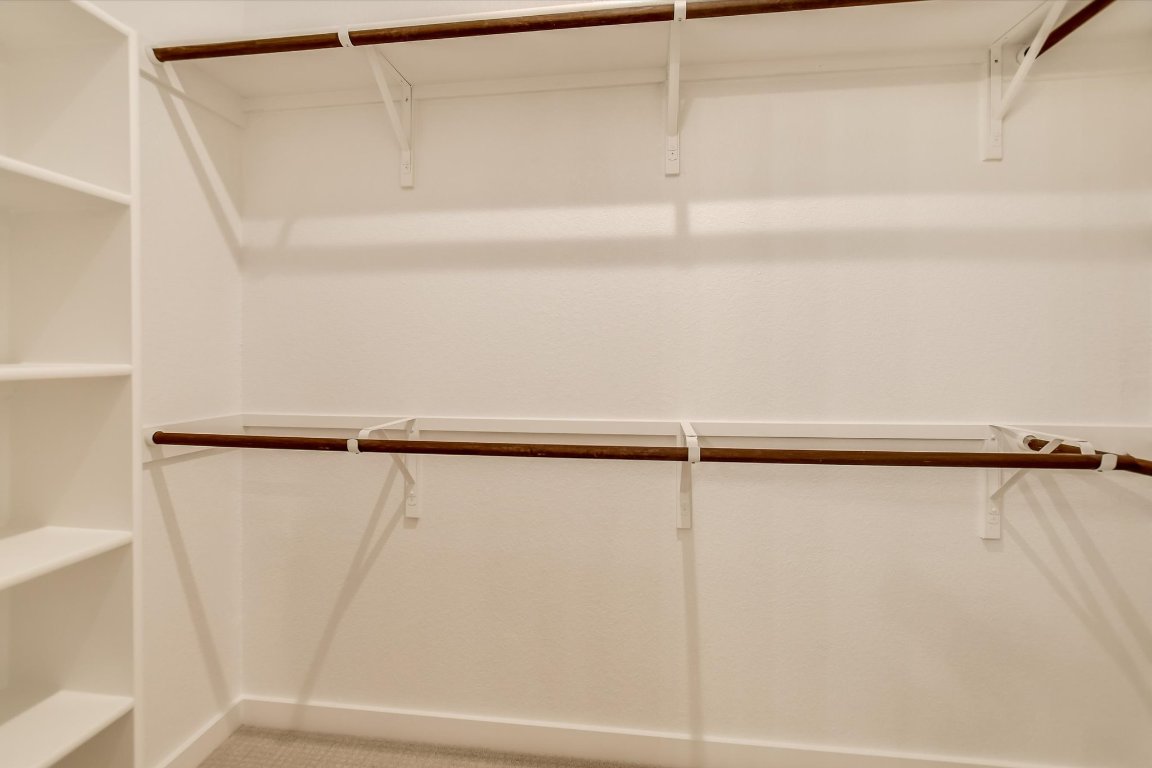 2500 Forest Creek Drive, Unit 2004 Round Rock, TX 78665 - Photo 16 of 27 a view of walk in closet with empty racks