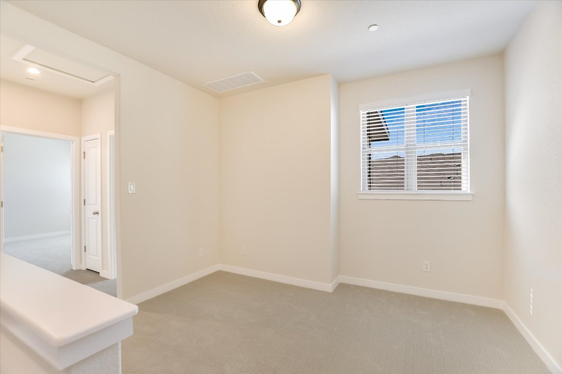 2500 Forest Creek Drive, Unit 2004 Round Rock, TX 78665 - Photo 19 of 27 a view of an empty room with a window