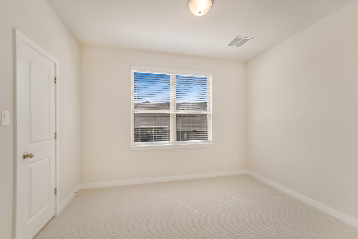 2500 Forest Creek Drive, Unit 2004 Round Rock, TX 78665 - Photo 21 of 27 an empty room with a window
