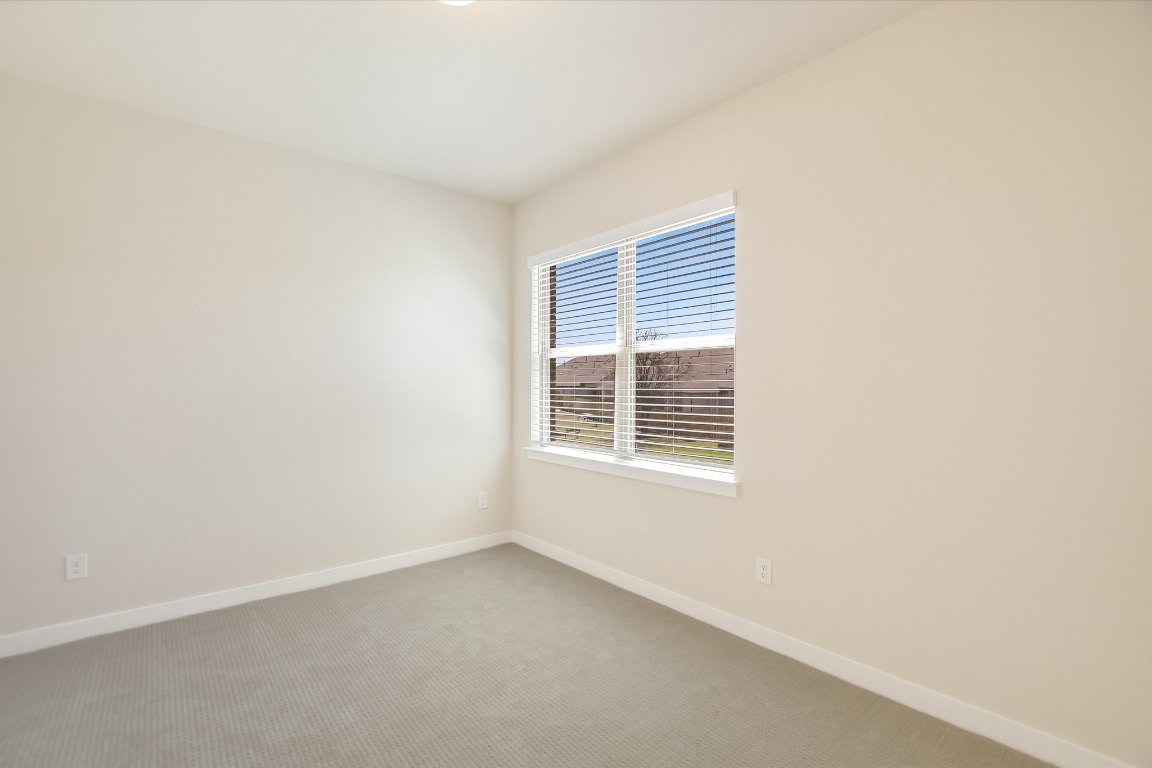 2500 Forest Creek Drive, Unit 2004 Round Rock, TX 78665 - Photo 23 of 27 a view of an empty room with a window