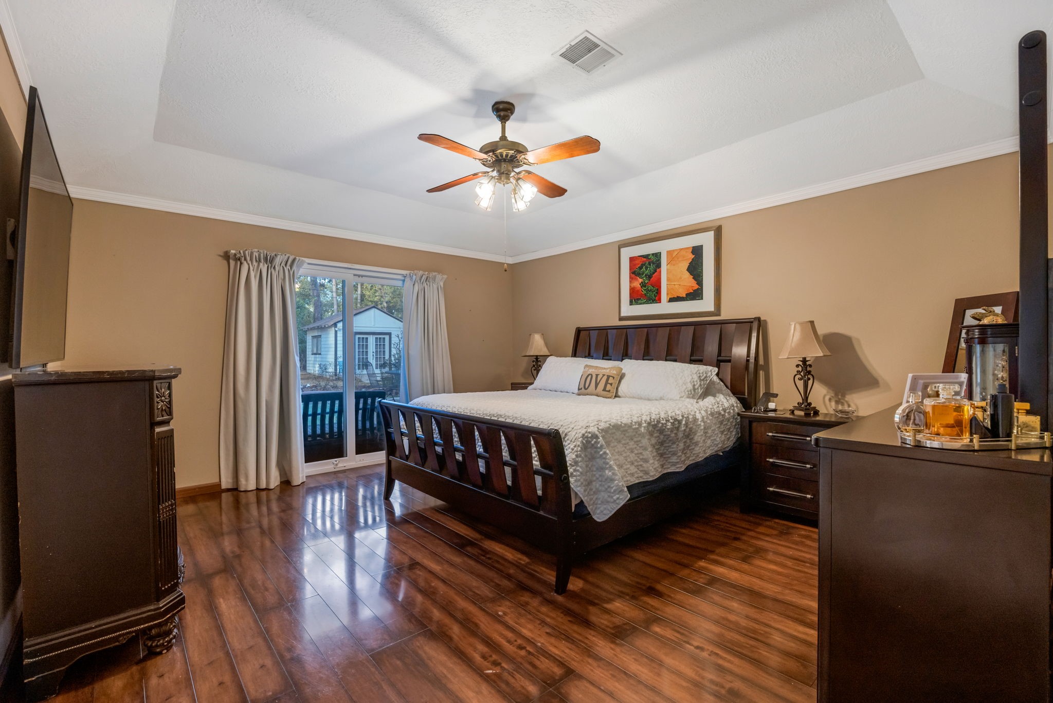 127 Sagewood Drive Spring, TX 77386 - Photo 11 of 18 a bedroom with a bed and wooden floor