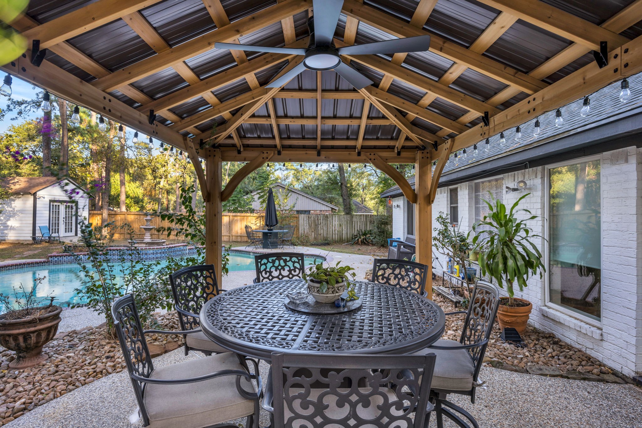 127 Sagewood Drive Spring, TX 77386 - Photo 16 of 18 a view of a patio with a table and chairs