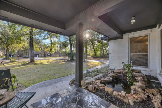 a view of a porch and garden