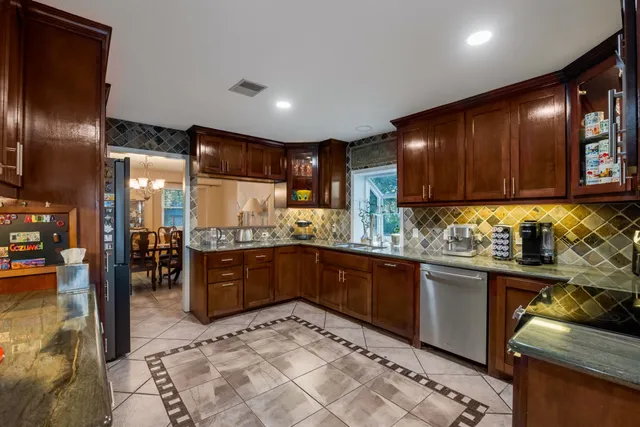 a kitchen with lots of counter top space and appliances