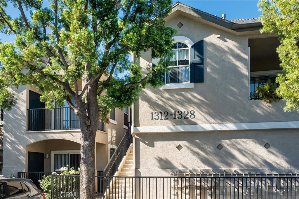 a view of a house with a tree
