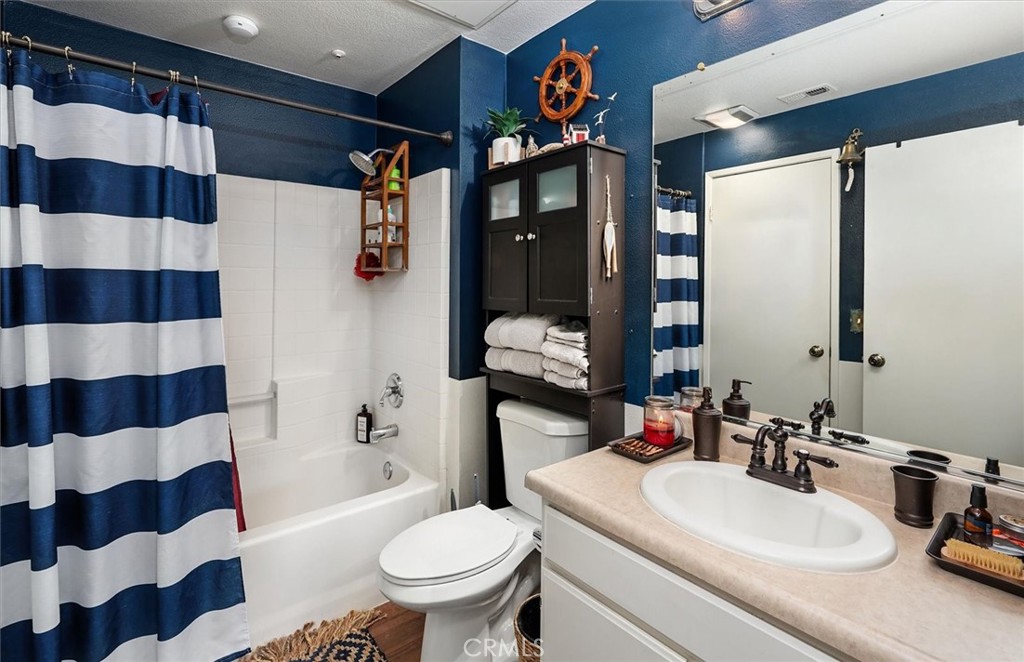 20000 Plum Canyon Road, Unit 1324 Saugus, CA 91350 - Photo 14 of 23 a bathroom with a sink and a mirror