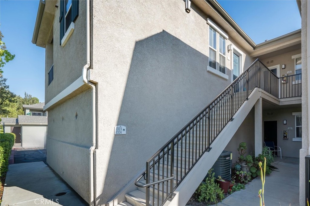 20000 Plum Canyon Road, Unit 1324 Saugus, CA 91350 - Photo 2 of 23 a view of staircase with railing and white walls