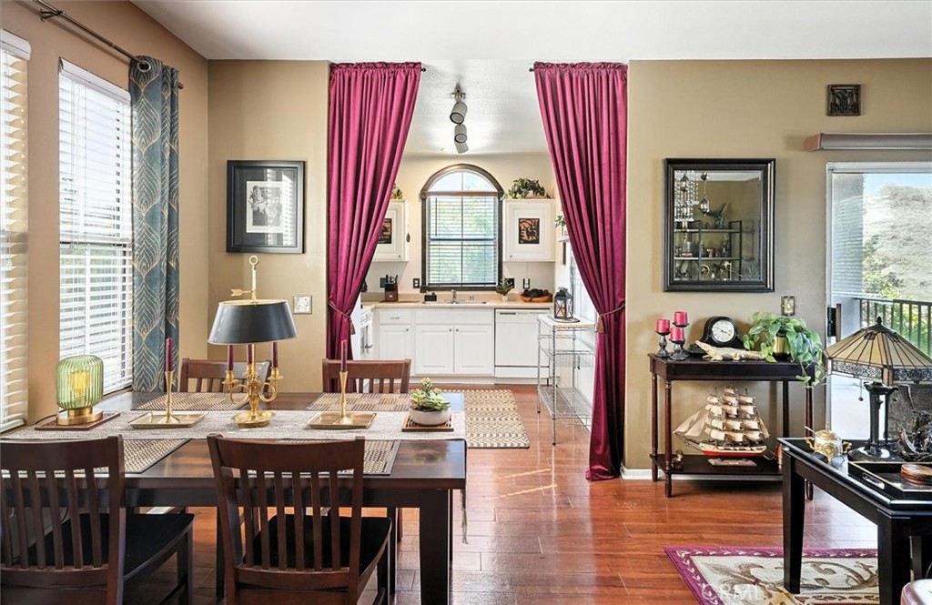 20000 Plum Canyon Road, Unit 1324 Saugus, CA 91350 - Photo 7 of 23 a view of a a dining room with furniture window and wooden floor