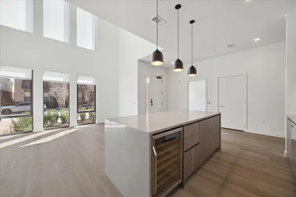 a view of a kitchen with a sink and window