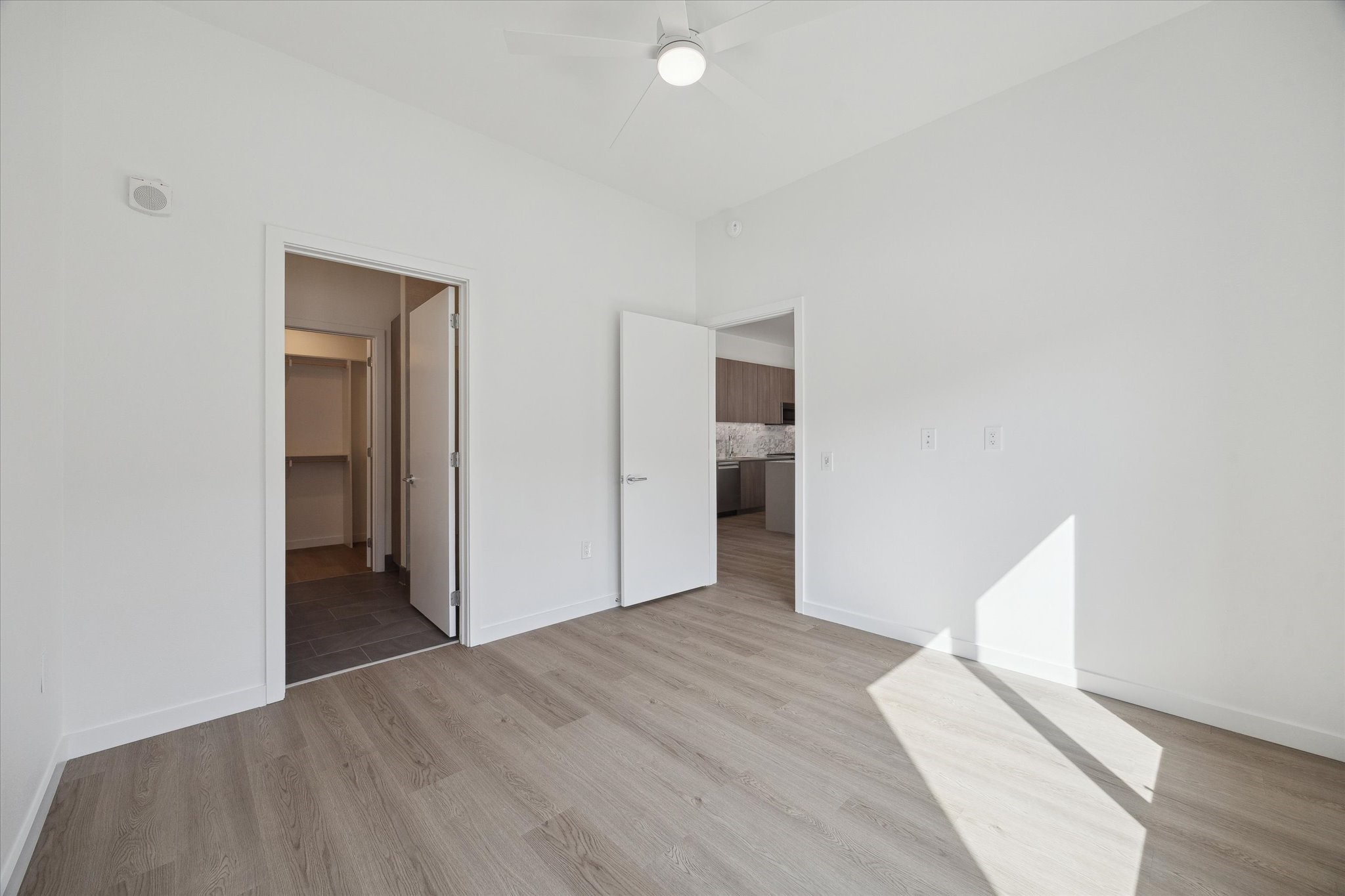 1 Riva Row, Unit 167 The Woodlands, TX 77380 - Photo 9 of 49 a view of an empty room with wooden floor and closet
