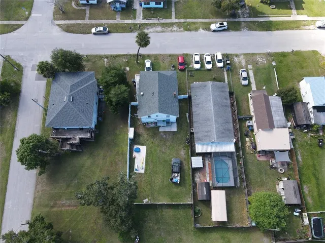 an aerial view of houses with outdoor space
