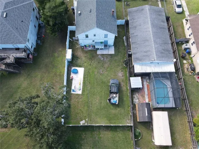 an aerial view of houses with outdoor space