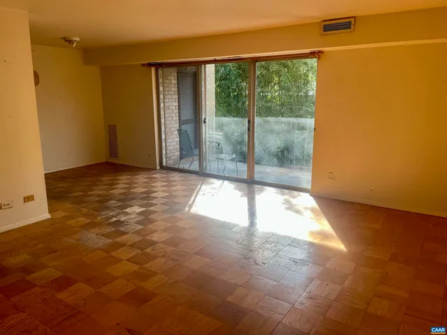 a view of a room with a large window