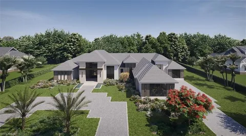 a aerial view of a house next to a yard