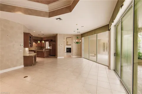 a view of a kitchen with a refrigerator and a stove