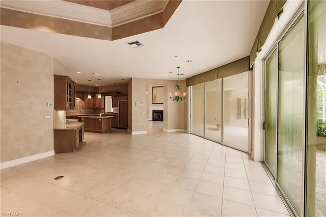 a view of a kitchen with a refrigerator and a stove