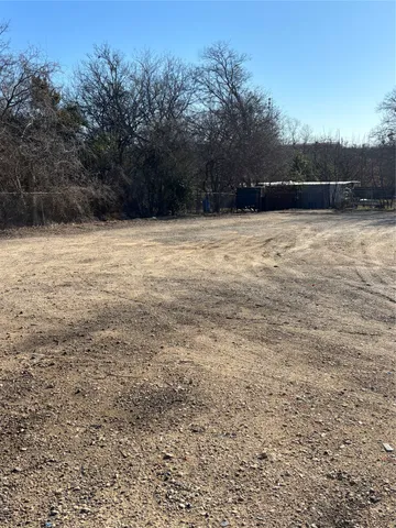 a view of outdoor space with swimming pool and trees