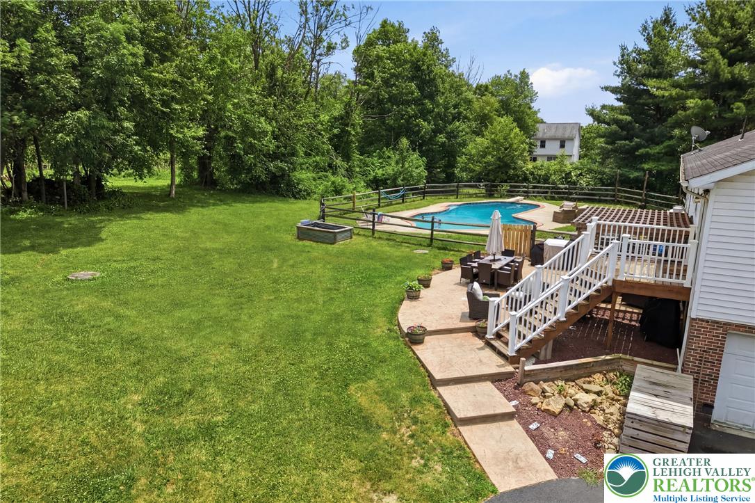 732 Bushkill Center Road Nazareth, PA 18064 - Photo 38 of 43 An inviting backyard oasis offers a sparkling pool and spacious patio for outdoor entertaining.