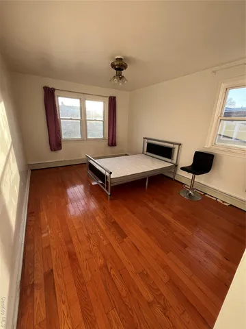 wooden floor with windows and hardwood floor