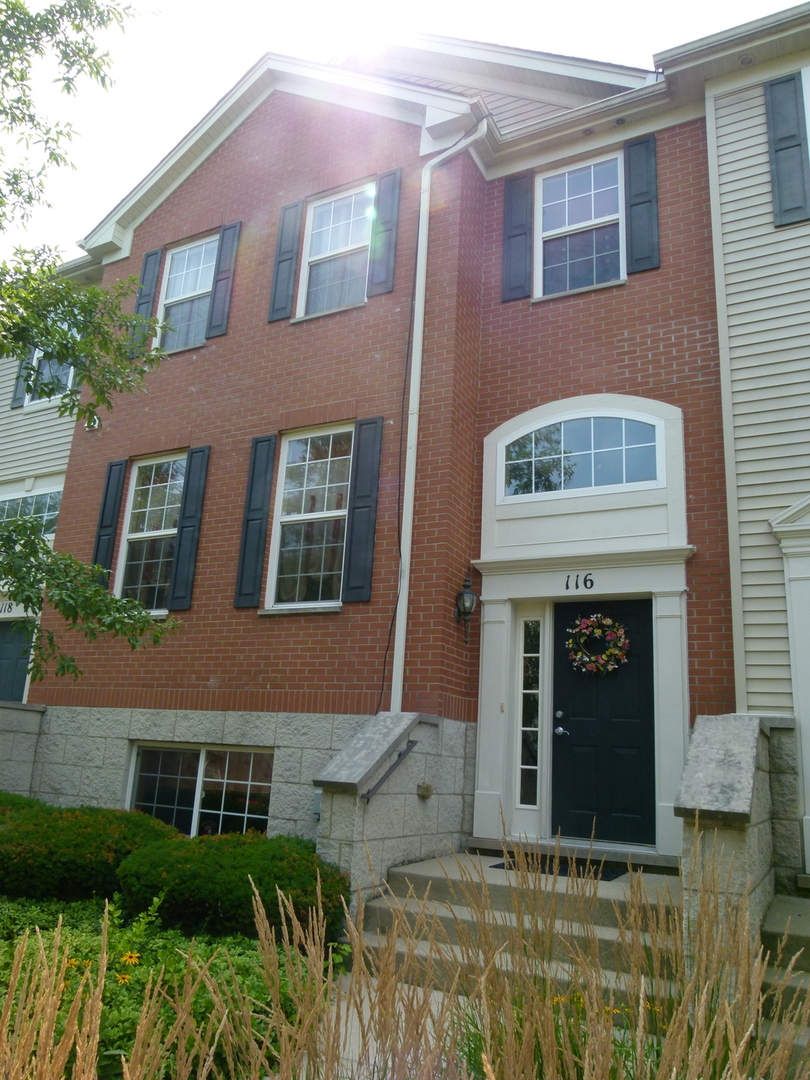 a view of front a house with large windows