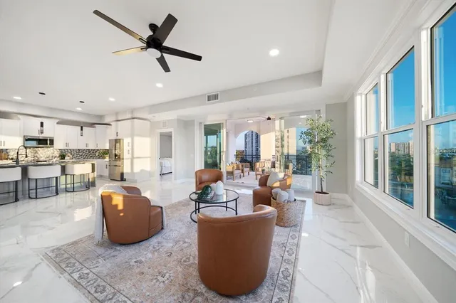 a living room with furniture and a large window