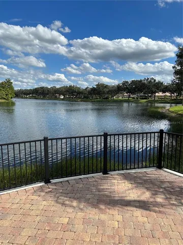 a view of a house with backyard and porch