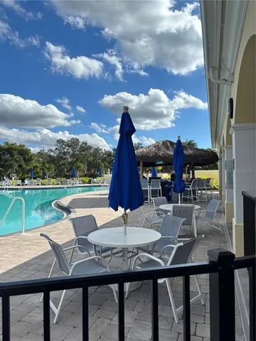 a view of a swimming pool with a patio