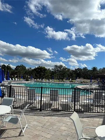 a view of a grassy field with an trees