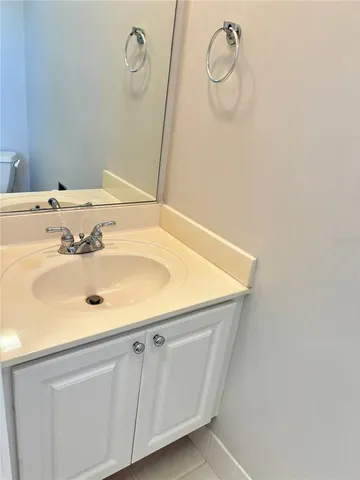 a bathroom with a sink and vanity