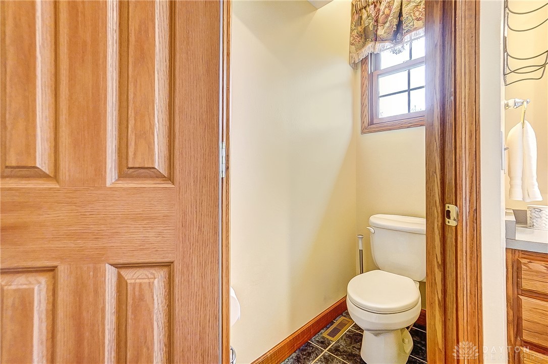 1540 Jasper Road Xenia, OH 45385 - Photo 33 of 91 This clean and inviting bathroom features a functional toilet and a vanity with ample storage.