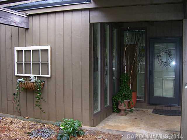 4723 Rounding Run Road, Unit 5 Charlotte, NC 28277 - Photo 1 of 12 a backyard of a house with potted plants