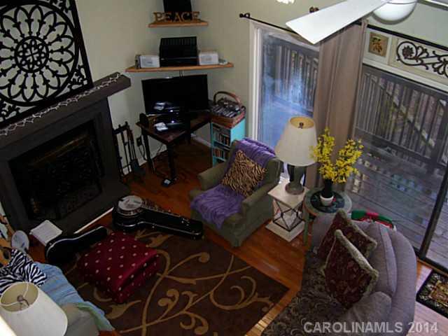 4723 Rounding Run Road, Unit 5 Charlotte, NC 28277 - Photo 6 of 12 a living room with furniture and a fireplace