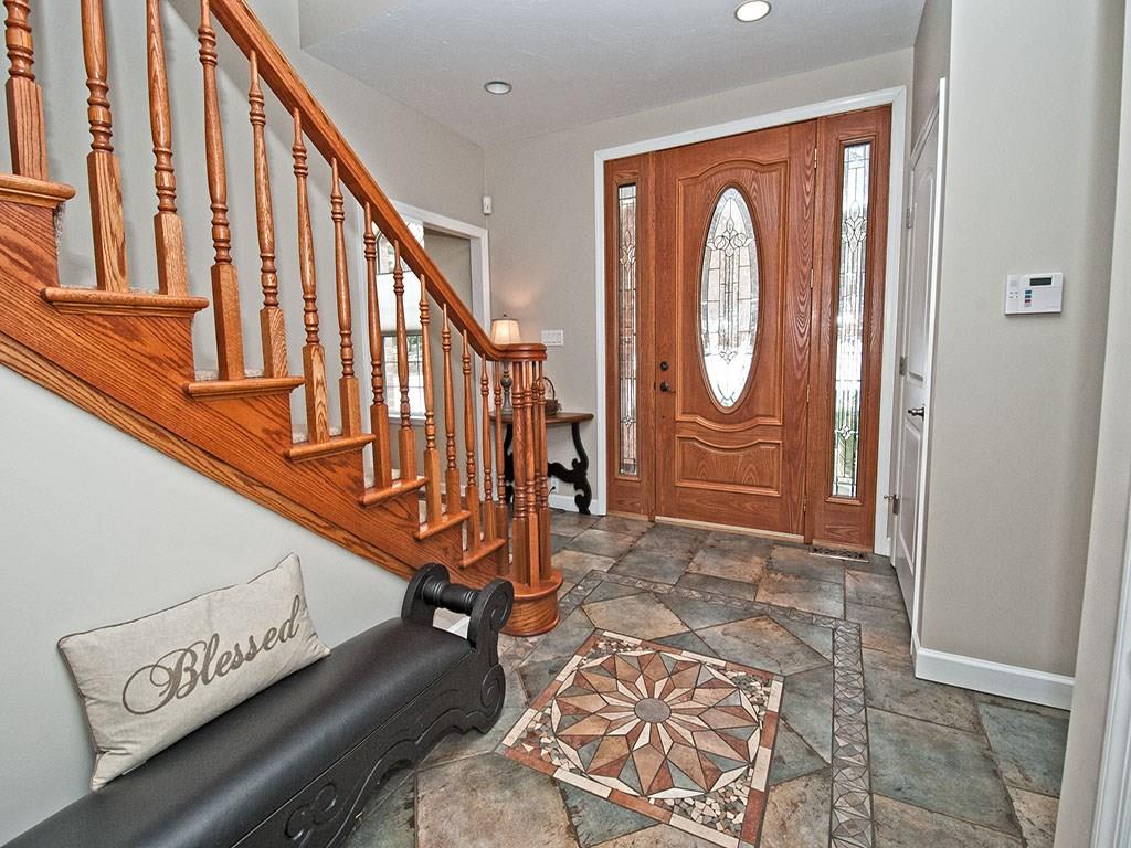 835 Old Mill Road Fox Chapel, PA 15238 - Photo 3 of 25 Such a gracious entry with solid wood custom made door and trims. The staircase is custom designed plus extra wide to easily move furniture. Artisan imported tile work adds beauty and functionality.