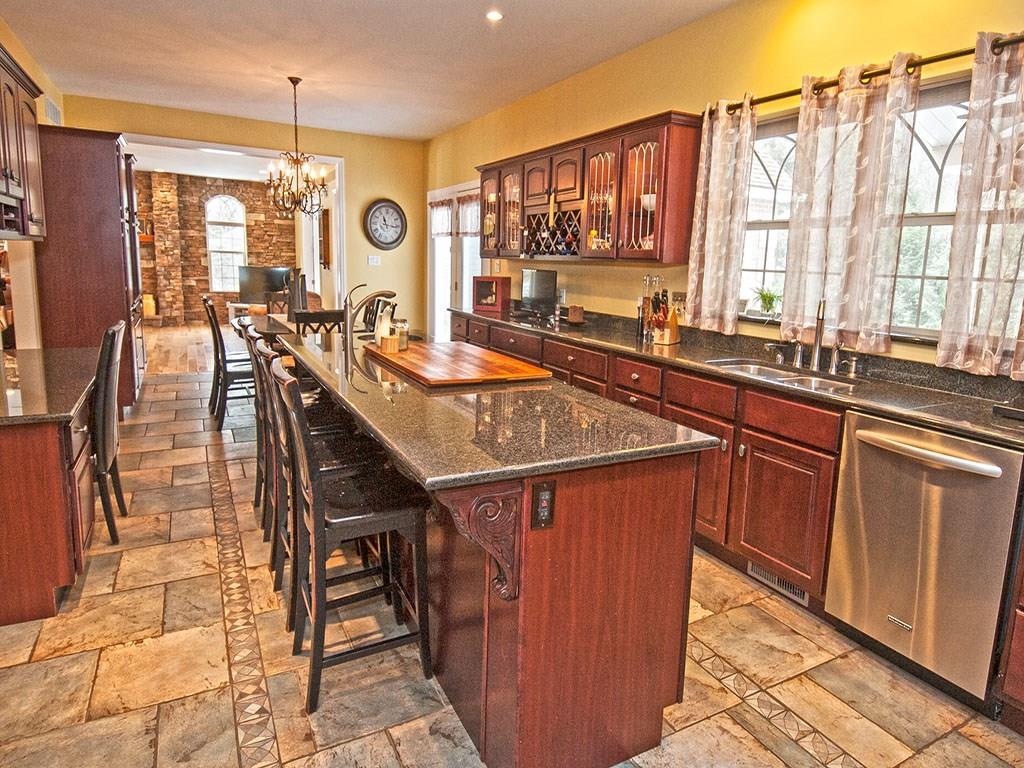 835 Old Mill Road Fox Chapel, PA 15238 - Photo 4 of 25 A wonderful kitchen with Dacor stainless appliance, granite, accent lighting, custom cabinetry and island. Breakfast nook and fireplace make it a special place for cooking and dining.
