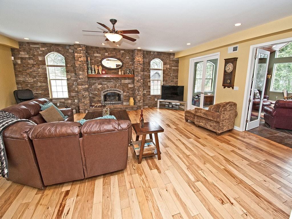 835 Old Mill Road Fox Chapel, PA 15238 - Photo 9 of 25 The perfect room for many activities with hardwood floors, double french doors and imported stone fireplace.