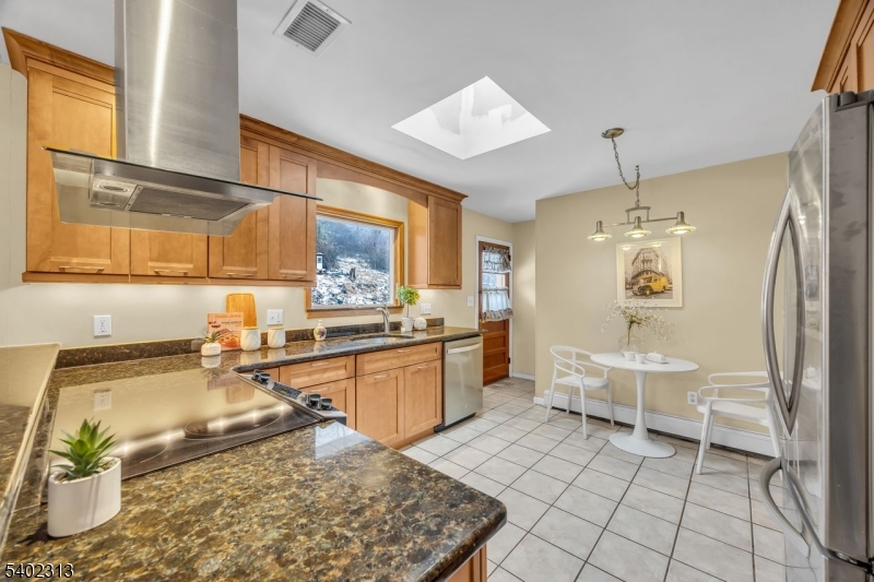 128 Old Croton Road Flemington, NJ 08822 - Photo 11 of 35 a large kitchen with kitchen island granite countertop a sink and a refrigerator