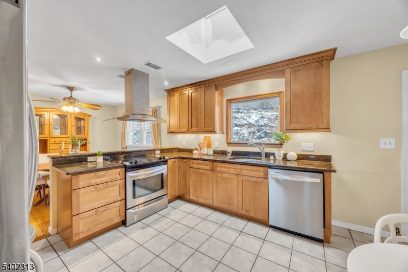 128 Old Croton Road Flemington, NJ 08822 - Photo 13 of 35 a kitchen with stainless steel appliances granite countertop a stove a sink and a microwave