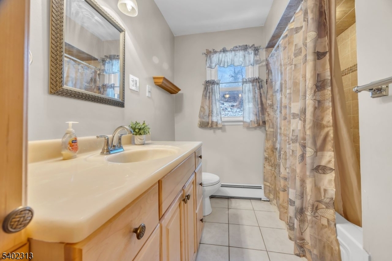 128 Old Croton Road Flemington, NJ 08822 - Photo 15 of 35 a bathroom with a sink toilet and shower