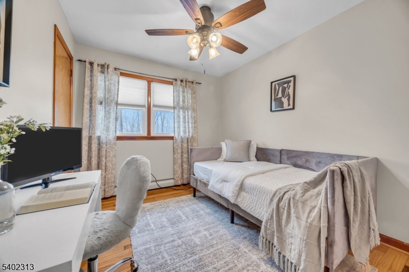 128 Old Croton Road Flemington, NJ 08822 - Photo 16 of 35 a bedroom with a bed and a flat screen tv