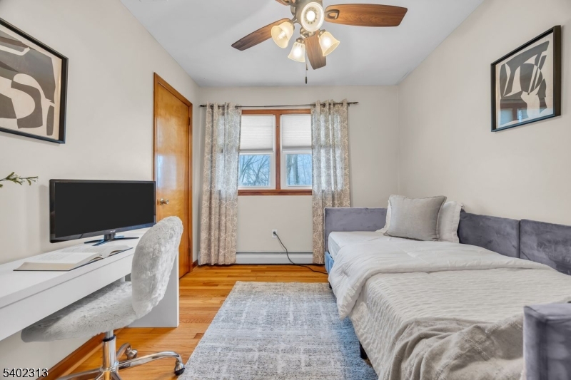 128 Old Croton Road Flemington, NJ 08822 - Photo 17 of 35 a bedroom with a bed and a flat tv screen on the dresser