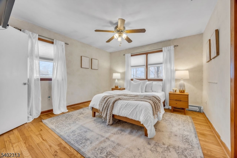 128 Old Croton Road Flemington, NJ 08822 - Photo 18 of 35 a spacious bedroom with a bed and a chandelier