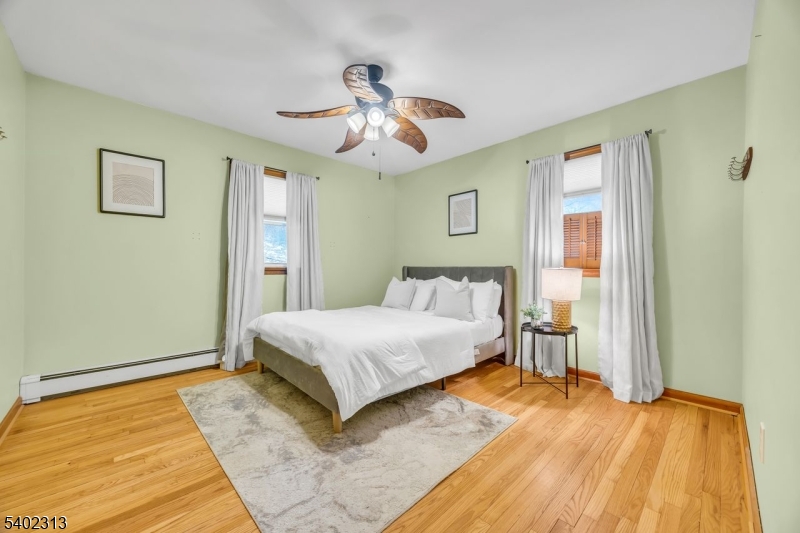 128 Old Croton Road Flemington, NJ 08822 - Photo 21 of 35 a bedroom with a bed and wooden floor