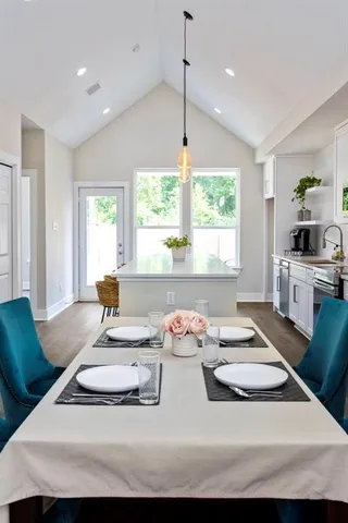 a view of a dining room with furniture window and outside view
