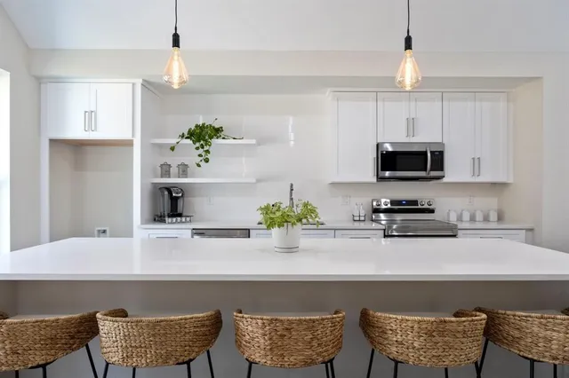 a kitchen with a table and chair