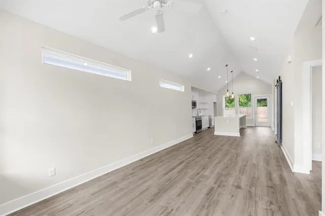 a view of a living room with wooden floor