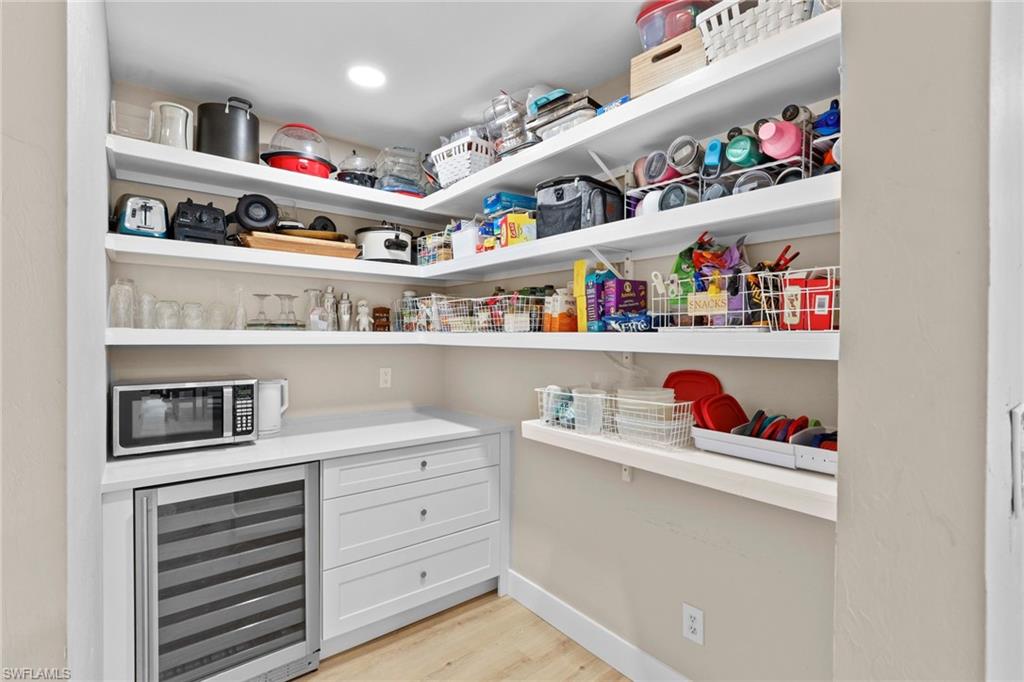 3221 68th Street Southwest Naples, FL 34105 - Photo 13 of 38 a room with storage and utility racks