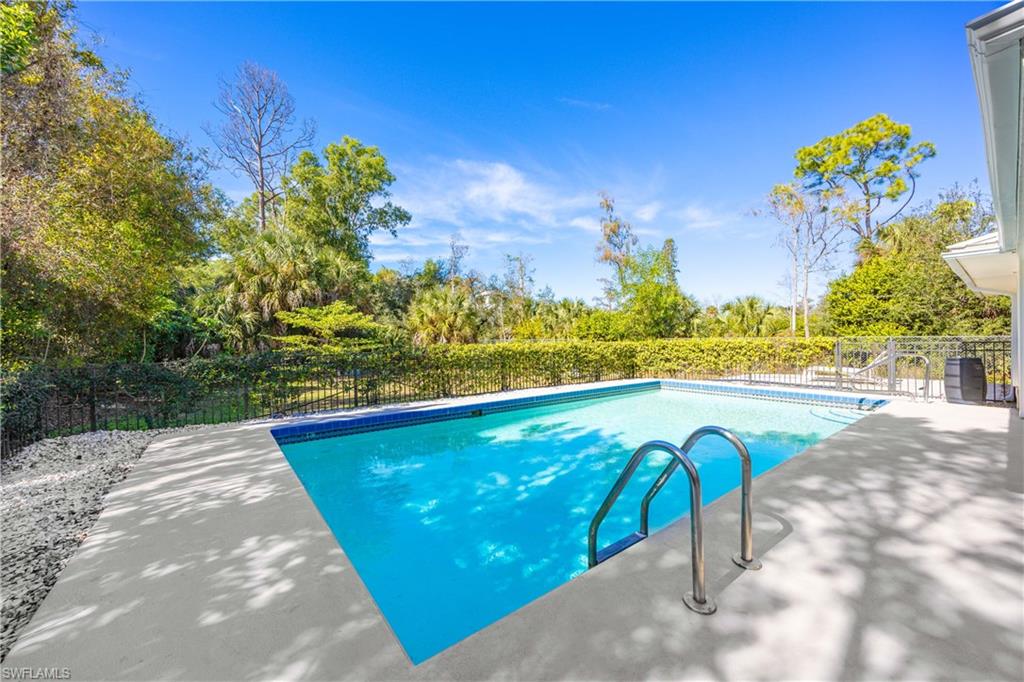 3221 68th Street Southwest Naples, FL 34105 - Photo 27 of 38 a view of swimming pool with seating space