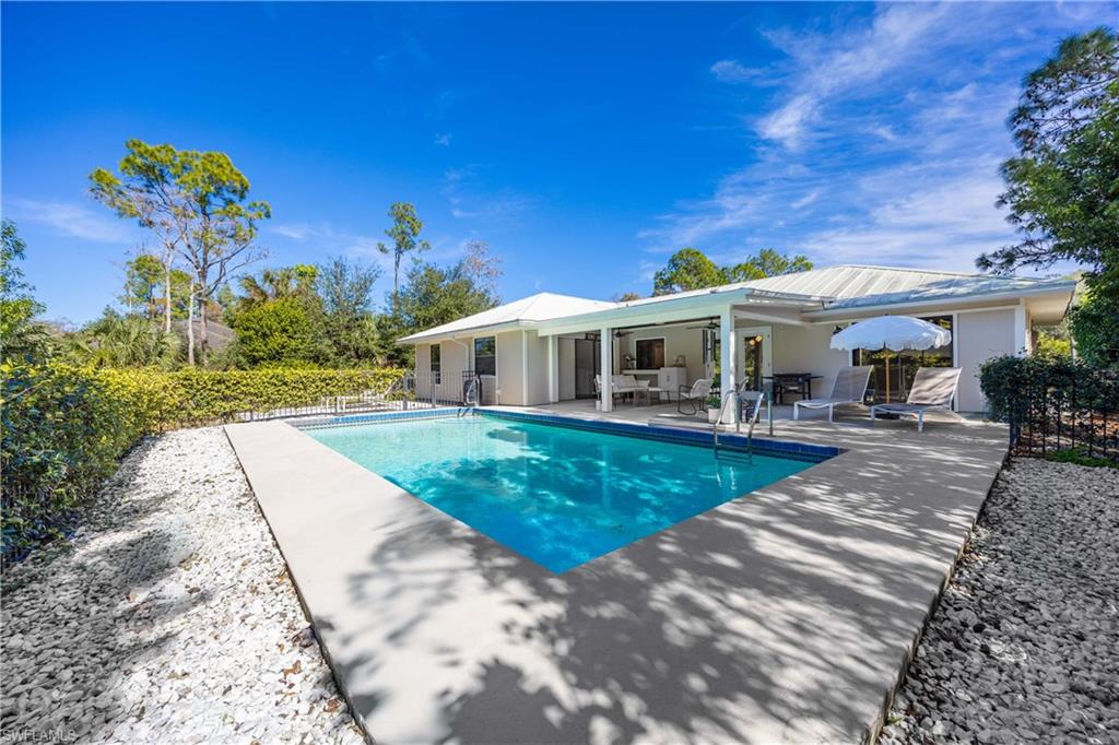 3221 68th Street Southwest Naples, FL 34105 - Photo 28 of 38 a view of a house with a yard