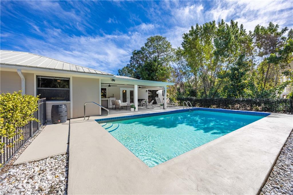 3221 68th Street Southwest Naples, FL 34105 - Photo 29 of 38 a view of a house with backyard porch and garden