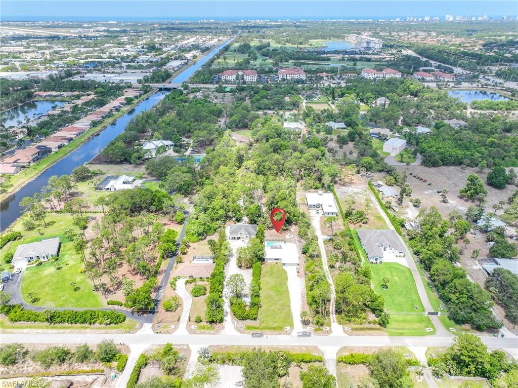 3221 68th Street Southwest Naples, FL 34105 - Photo 38 of 38 an aerial view of residential houses with outdoor space
